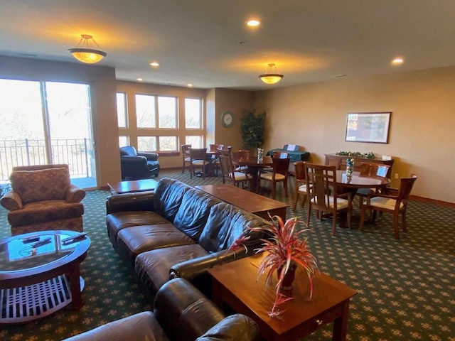 living room featuring recessed lighting, baseboards, and carpet flooring