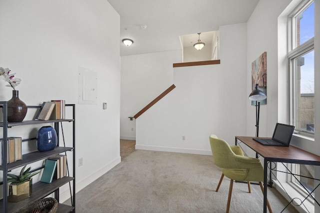 home office with electric panel, carpet flooring, and baseboards