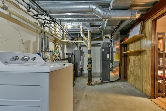 unfinished basement with heating unit, washer / dryer, and gas water heater