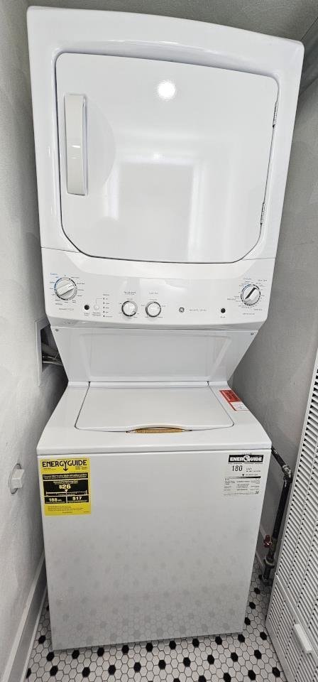 laundry area featuring laundry area and stacked washing maching and dryer