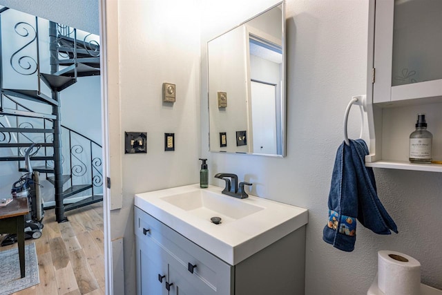 bathroom featuring wood finished floors and vanity