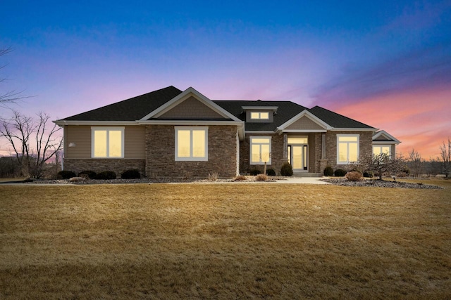 craftsman-style home with a front yard