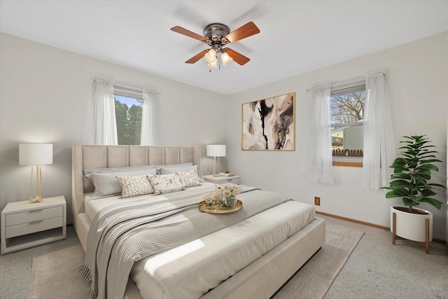 bedroom with baseboards and ceiling fan