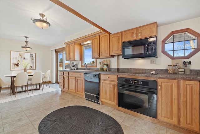 kitchen featuring pendant lighting, black appliances, a sink, dark countertops, and light tile patterned floors