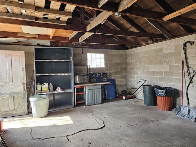 garage with concrete block wall