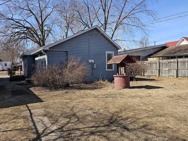 back of property featuring fence