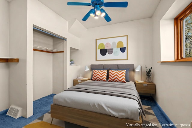 bedroom featuring a closet, visible vents, ceiling fan, and carpet