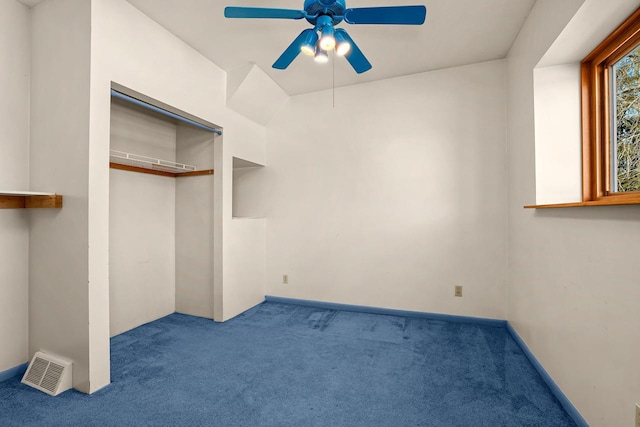 unfurnished bedroom with carpet flooring, a ceiling fan, visible vents, and a closet