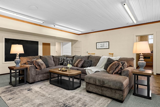 carpeted living room featuring baseboards