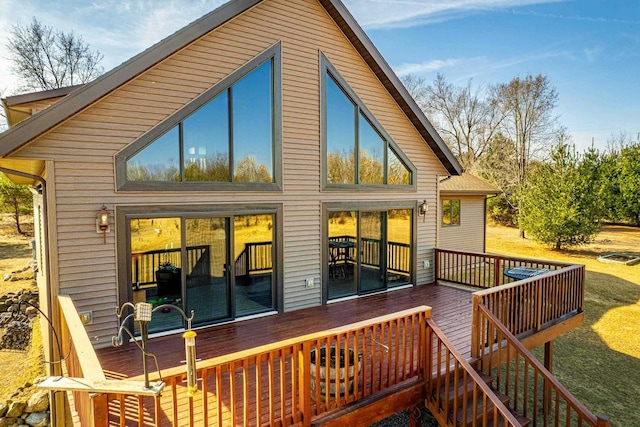 back of property with a wooden deck