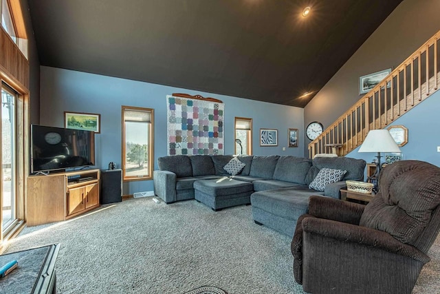 living room with stairway, carpet flooring, high vaulted ceiling, and visible vents