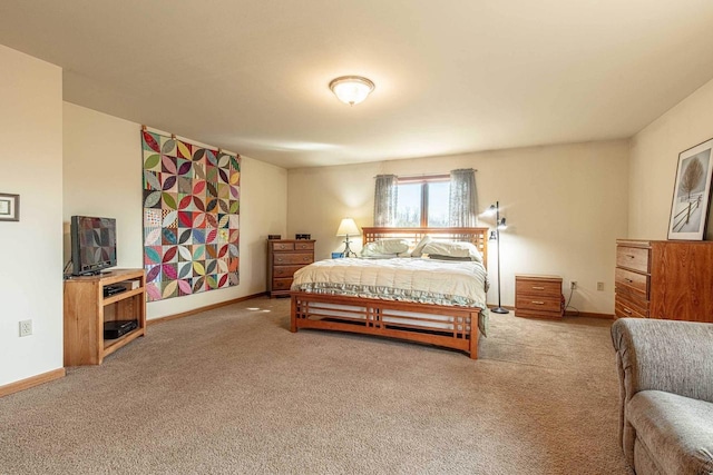 bedroom with carpet and baseboards