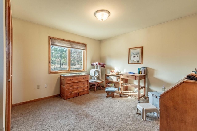 carpeted office space featuring baseboards