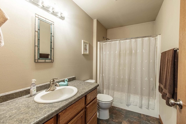 full bath with vanity, stone finish floor, toilet, and shower / tub combo with curtain