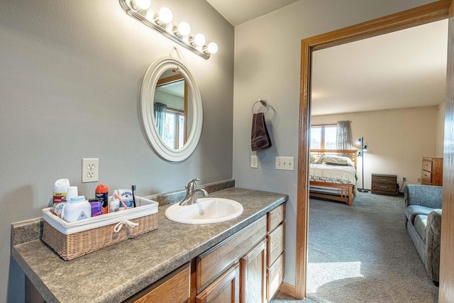 bathroom with vanity and connected bathroom