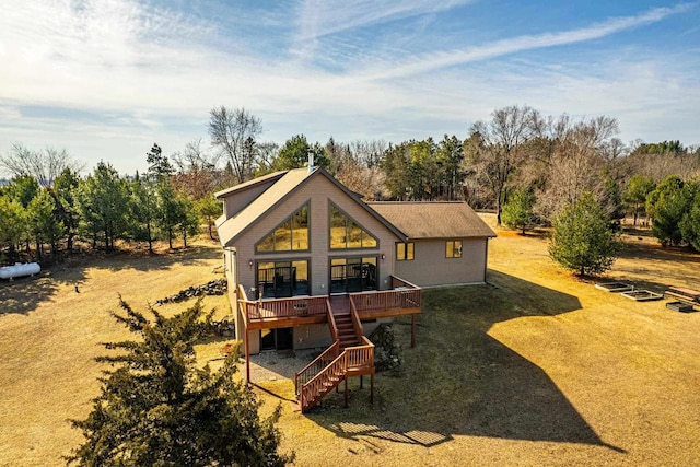 back of property with stairway and a wooden deck