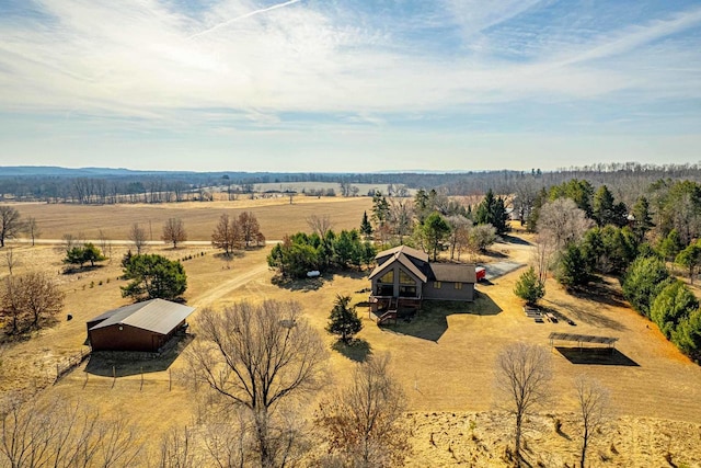 birds eye view of property featuring a rural view