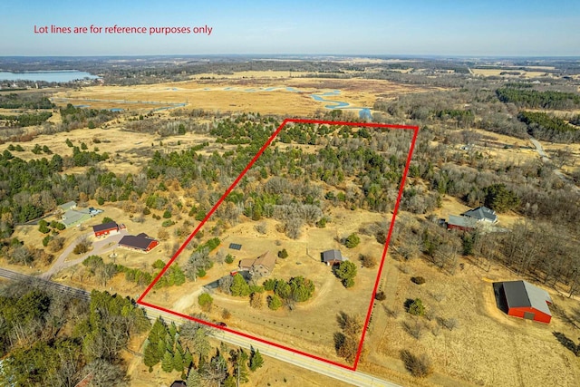 birds eye view of property with a rural view