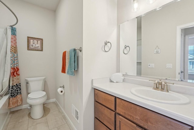 bathroom featuring vanity, visible vents, baseboards, tile patterned flooring, and toilet