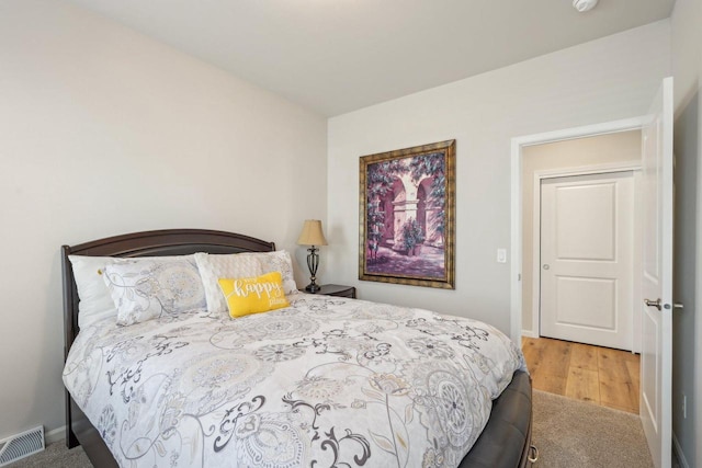 bedroom with visible vents and baseboards