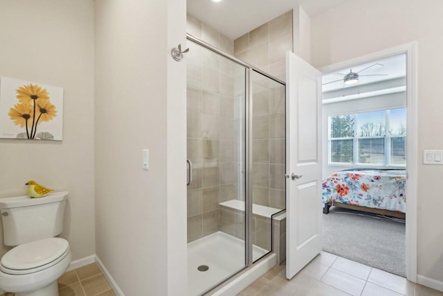 full bath featuring a shower stall, tile patterned floors, baseboards, and ensuite bathroom