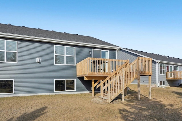 rear view of house with a wooden deck