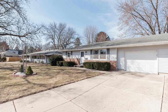 ranch-style house featuring brick siding, a front lawn, concrete driveway, and an attached garage