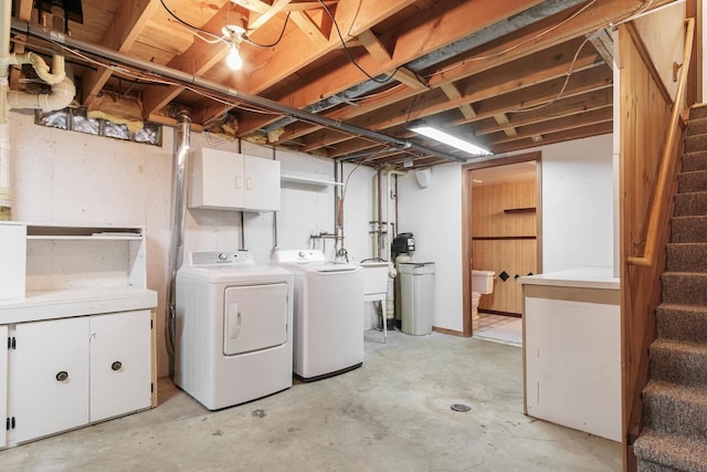 unfinished below grade area with washer and dryer and stairway