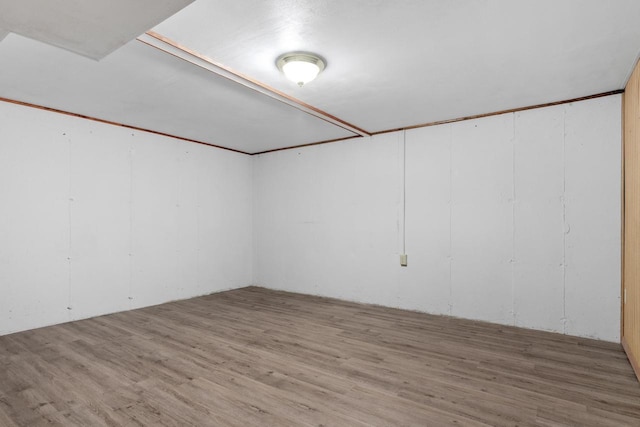 spare room featuring wood finished floors