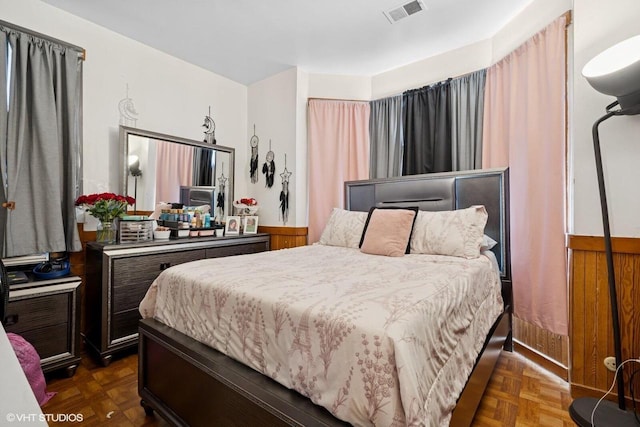 bedroom featuring visible vents