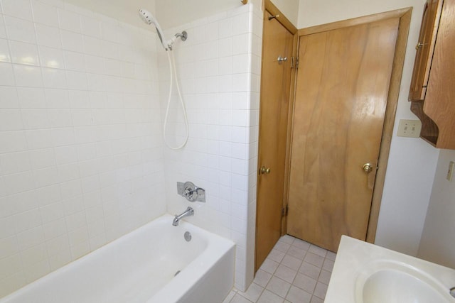 bathroom with a sink, bathtub / shower combination, and tile patterned floors