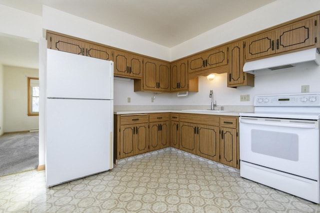 kitchen featuring under cabinet range hood, a sink, white appliances, light countertops, and light floors