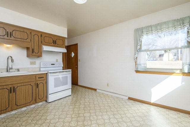 kitchen with under cabinet range hood, light floors, light countertops, electric range, and a sink