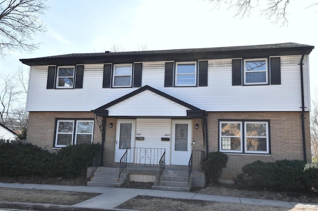 view of front of property featuring brick siding