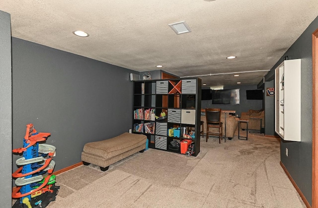 game room featuring visible vents, baseboards, carpet flooring, recessed lighting, and a textured ceiling