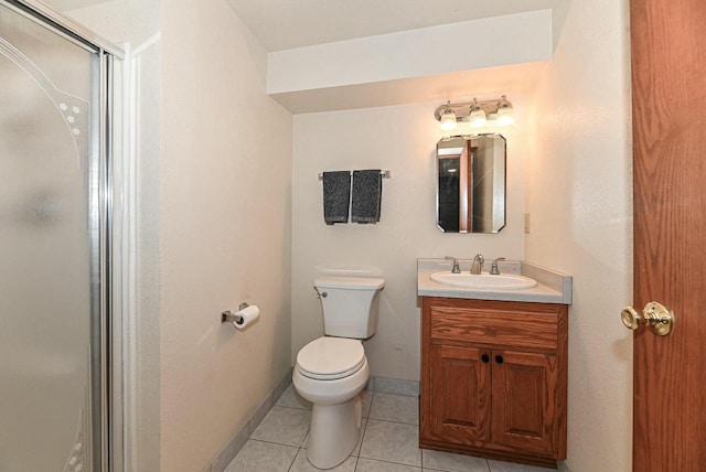 full bathroom with vanity, a shower with shower door, baseboards, tile patterned flooring, and toilet