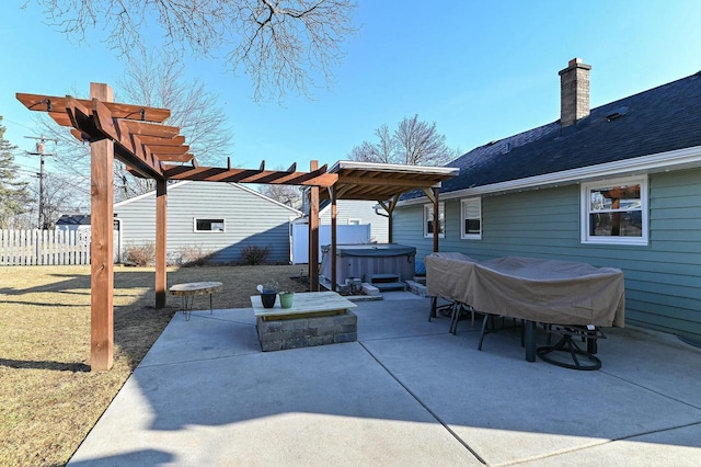 view of patio featuring fence, a pergola, and a hot tub