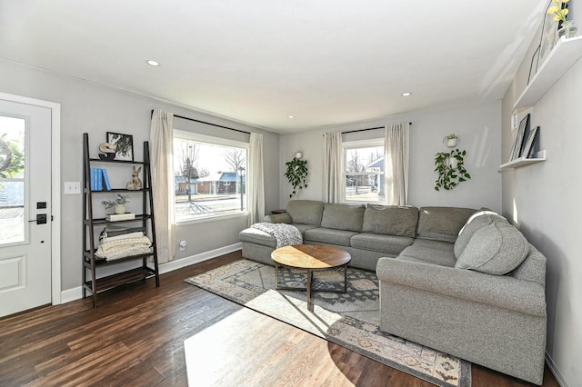 living room with recessed lighting, dark wood-type flooring, and baseboards