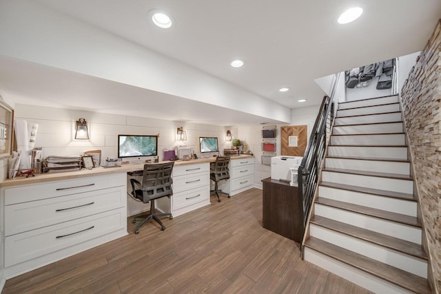 office space with recessed lighting, wood finished floors, and built in study area