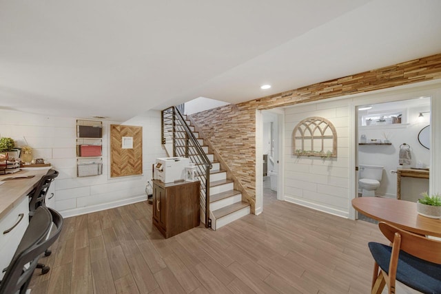 entrance foyer with stairway and light wood-style floors