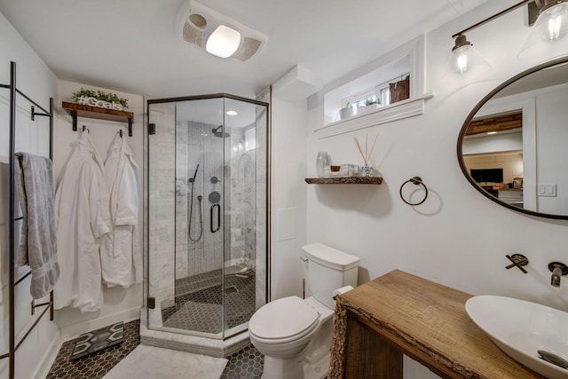 full bathroom featuring a sink, toilet, and a shower stall