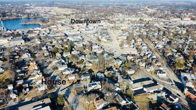 birds eye view of property with a water view and a residential view