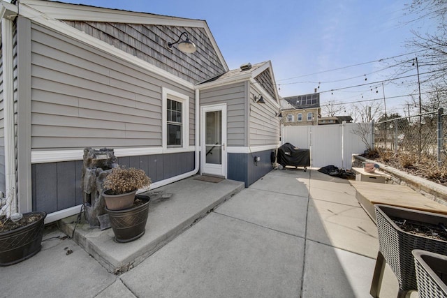 view of patio featuring fence