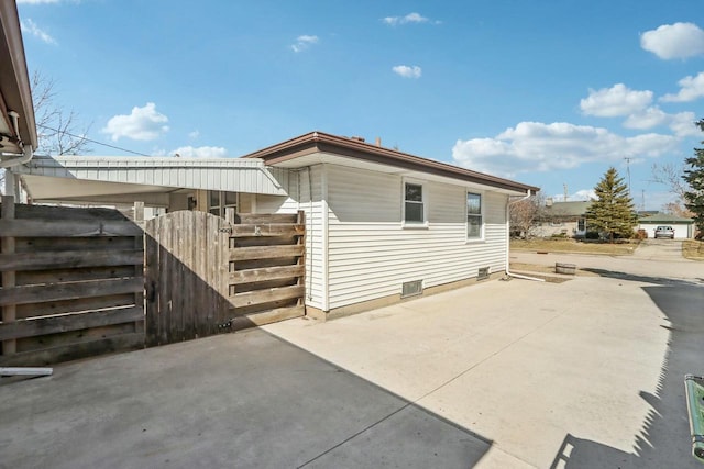 view of side of property featuring a patio