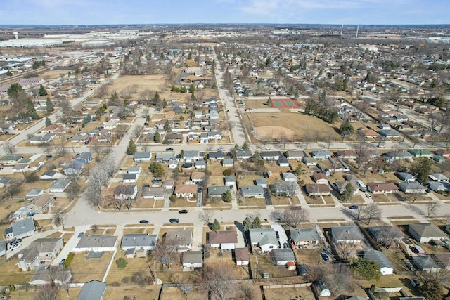 birds eye view of property with a residential view