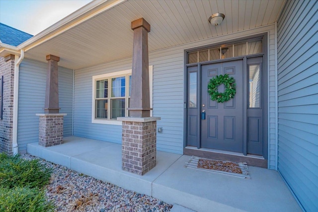 entrance to property featuring covered porch