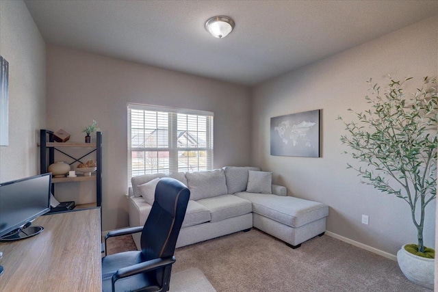 office with baseboards and carpet