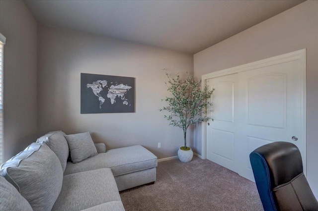 carpeted office space featuring baseboards