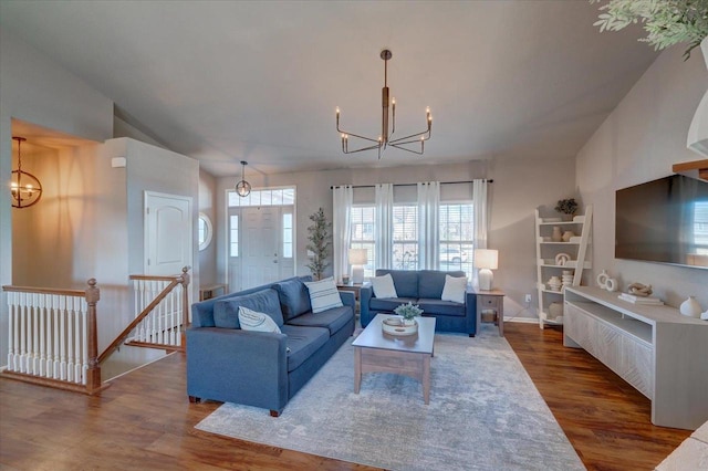 living area featuring an inviting chandelier and wood finished floors