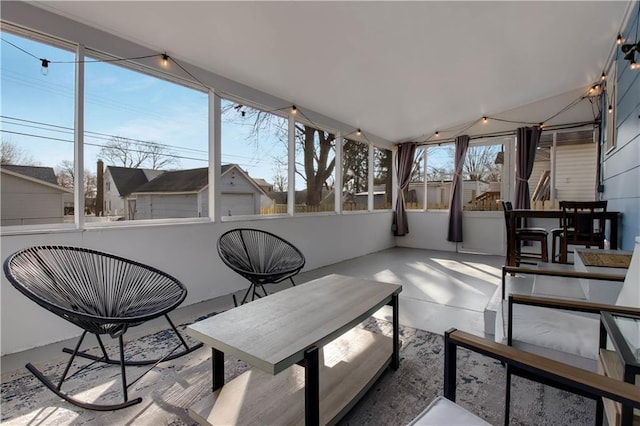 sunroom / solarium with lofted ceiling